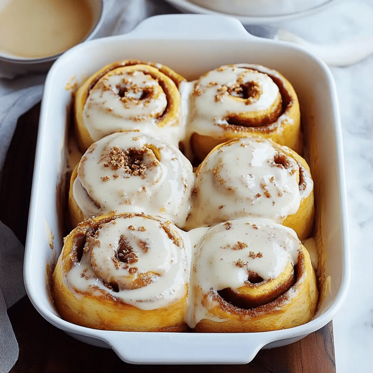 Pumpkin Cinnamon Rolls with Cream Cheese Maple Frosting
